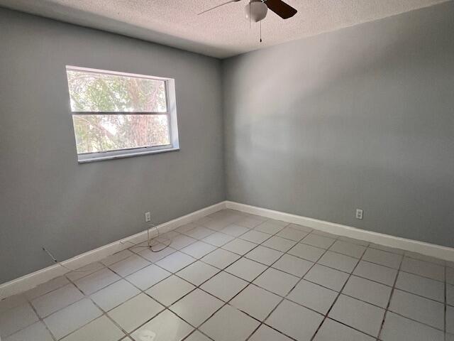 1798 Northwest 15th Vista, Unit 5 Boca Raton, FL 33432 - Photo 10 of 15 an empty room with windows