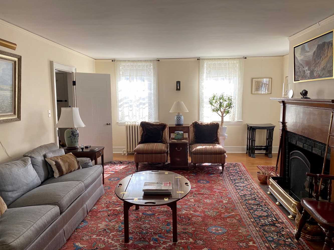4 Little Rest Road Millbrook, NY 12545 - Photo 6 of 12 a living room with furniture a fireplace and a window