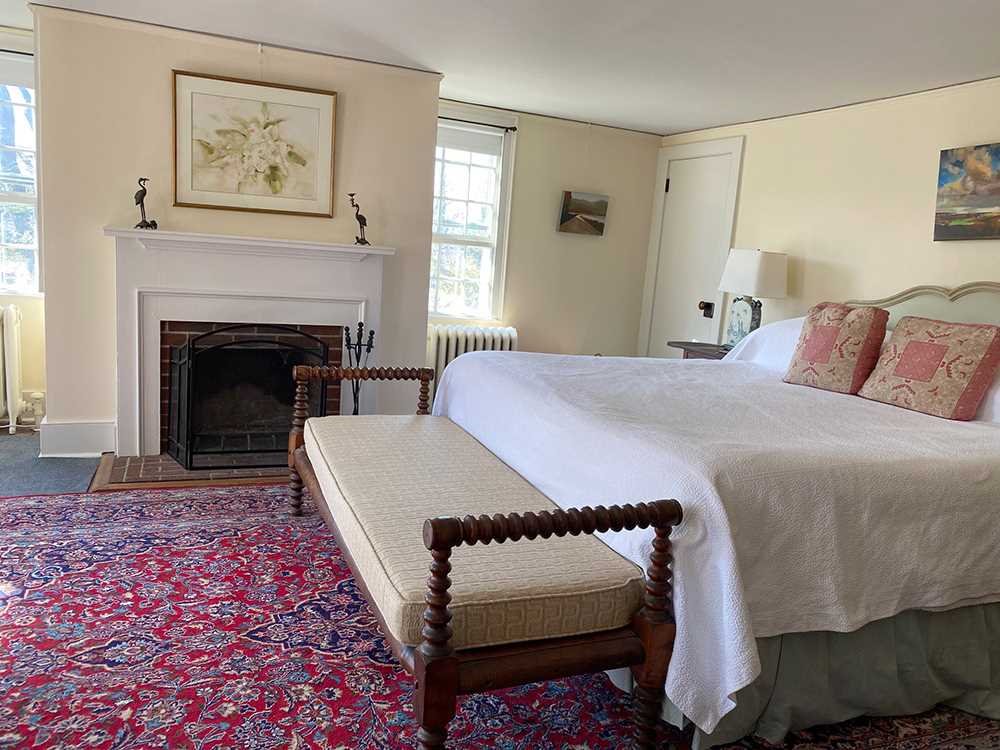 4 Little Rest Road Millbrook, NY 12545 - Photo 10 of 12 a bed room with a bed and a fireplace