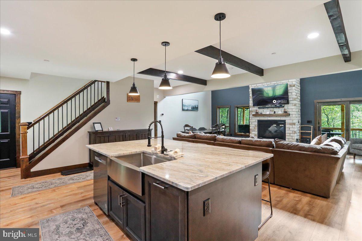 130 Lodestone Way Oakland, MD 21550 - Photo 14 of 47 a kitchen with stainless steel appliances kitchen island a table and chairs in it