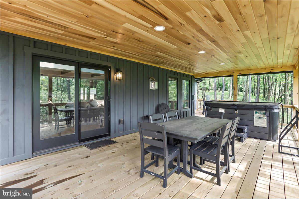 130 Lodestone Way Oakland, MD 21550 - Photo 18 of 47 a view of a dining room with furniture window and wooden floor