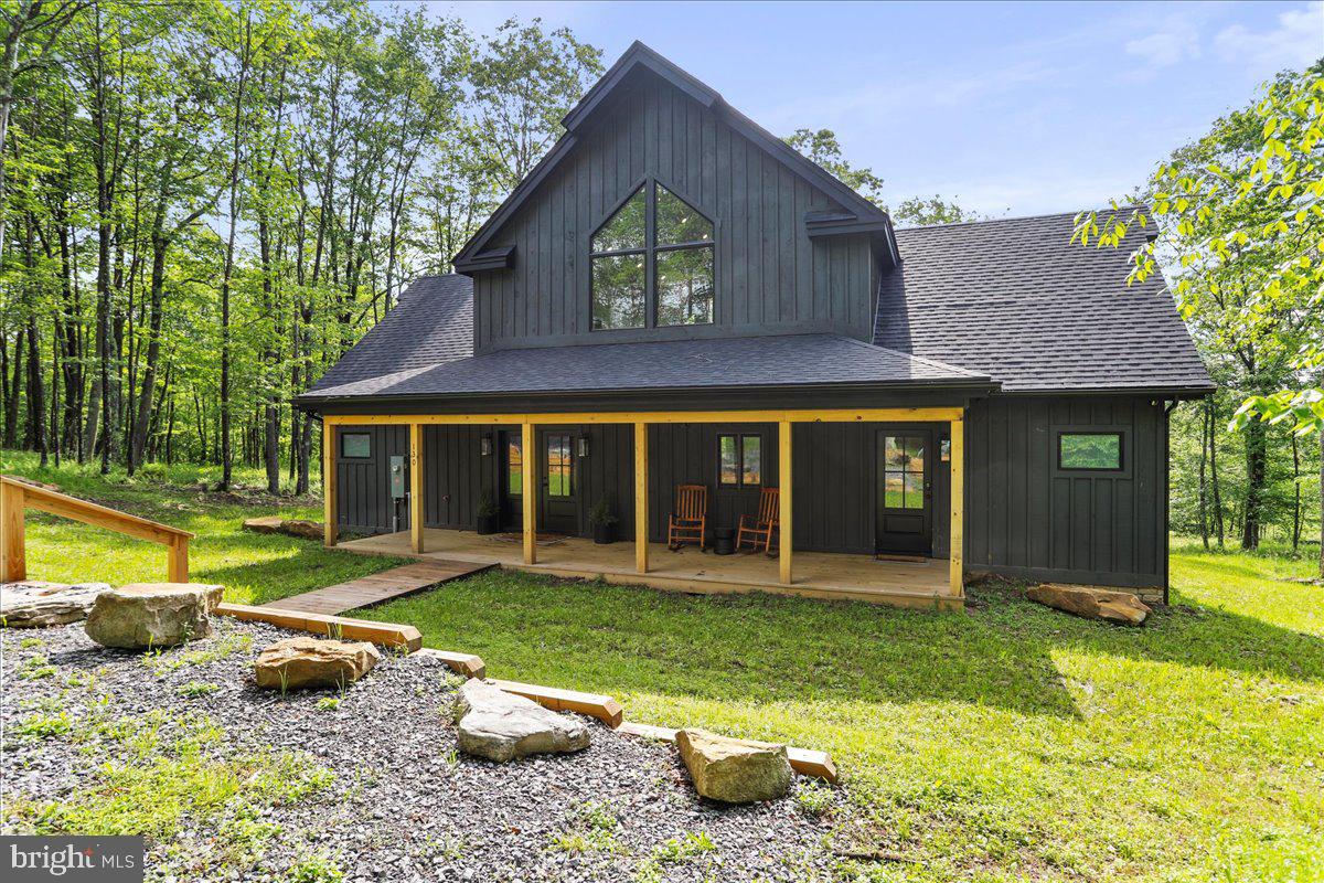 130 Lodestone Way Oakland, MD 21550 - Photo 2 of 47 a view of a house with a yard and sitting area