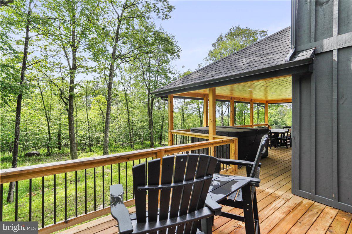 130 Lodestone Way Oakland, MD 21550 - Photo 21 of 47 a view of a two chairs and table in the balcony