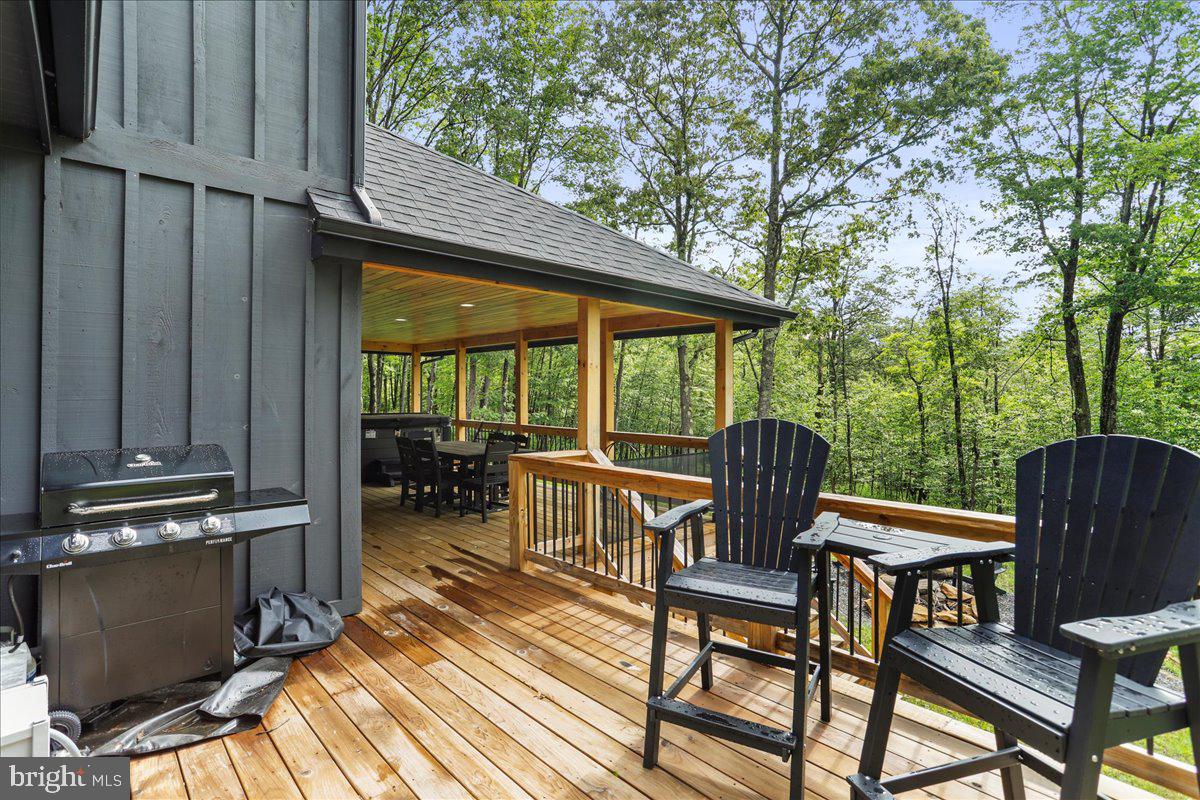 130 Lodestone Way Oakland, MD 21550 - Photo 23 of 47 a view of a chairs and table in the balcony