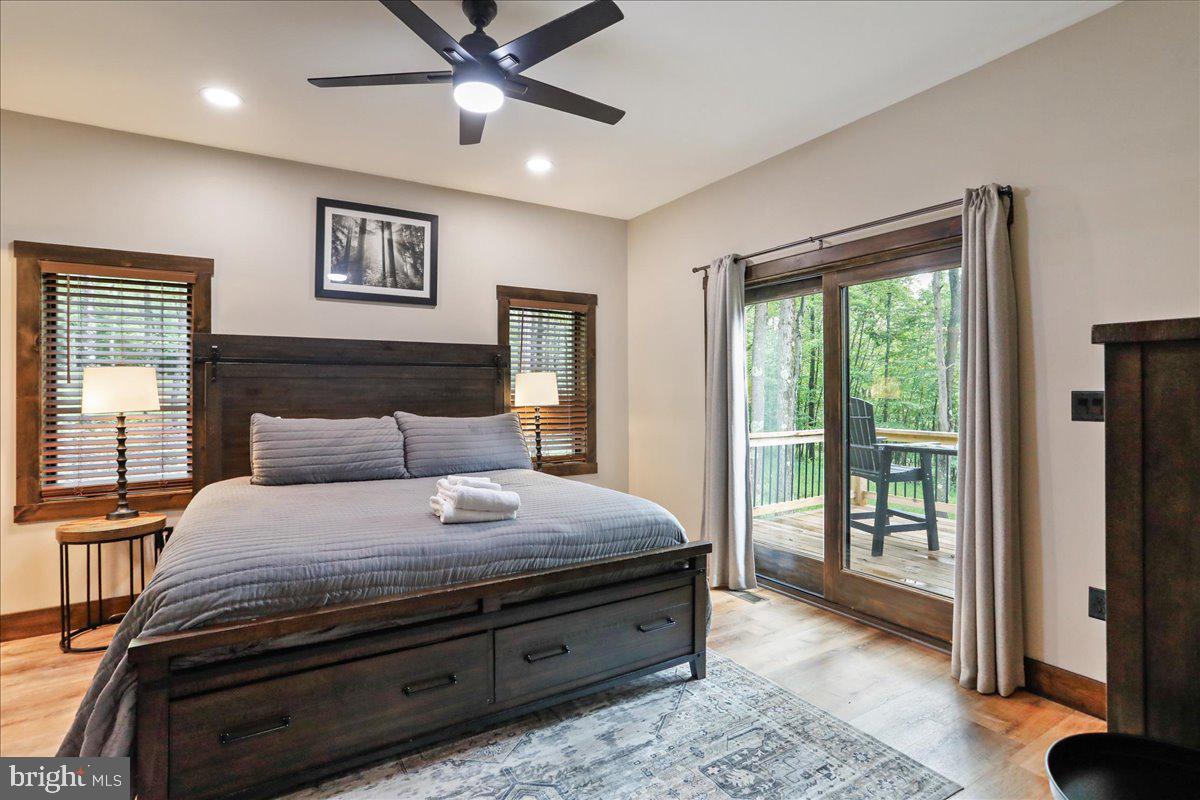 130 Lodestone Way Oakland, MD 21550 - Photo 26 of 47 a bedroom with a large bed and a window