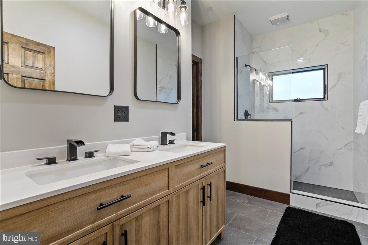 130 Lodestone Way Oakland, MD 21550 - Photo 28 of 47 a bathroom with a sink and a mirror