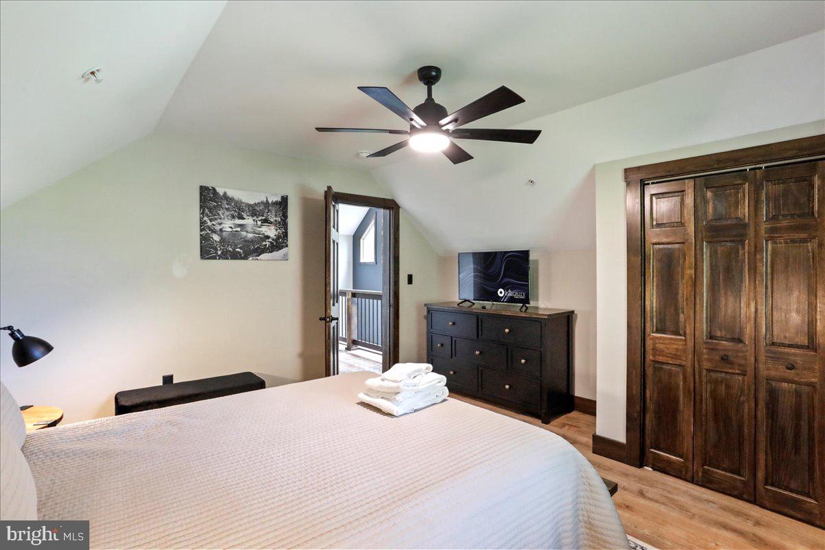 130 Lodestone Way Oakland, MD 21550 - Photo 34 of 47 a bedroom with a bed and a flat screen tv