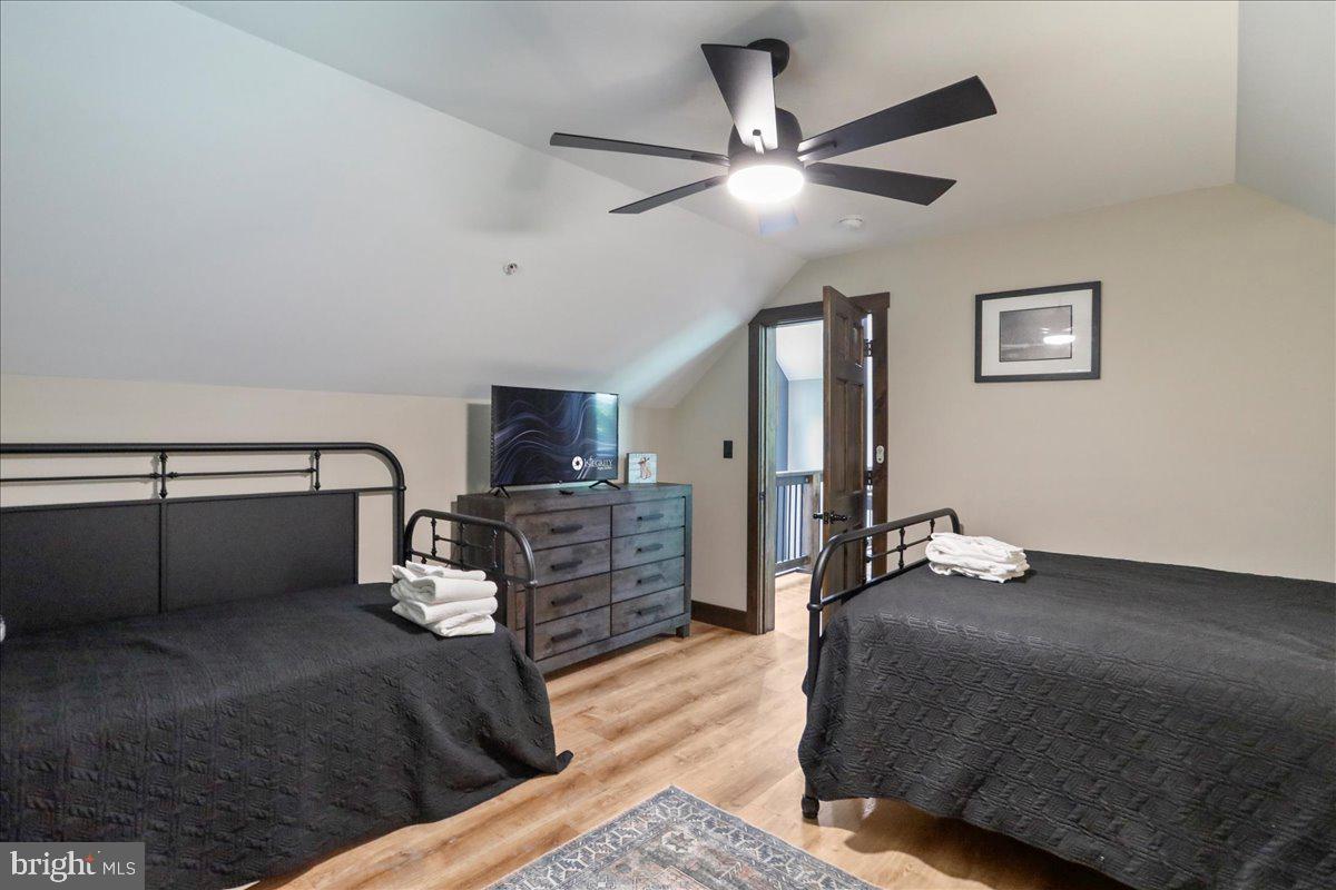 130 Lodestone Way Oakland, MD 21550 - Photo 35 of 47 a bedroom with a bed and ceiling fan