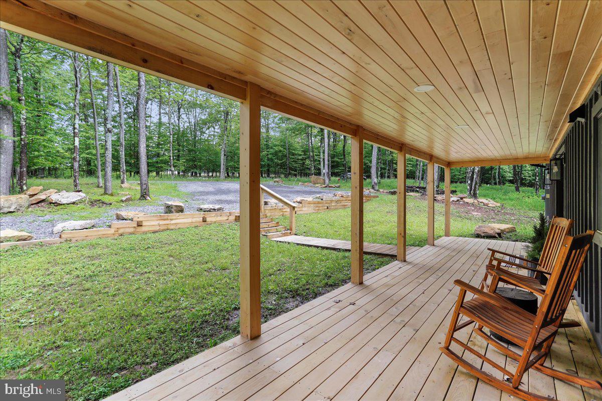 130 Lodestone Way Oakland, MD 21550 - Photo 5 of 47 a view of a house with backyard porch and wooden floor