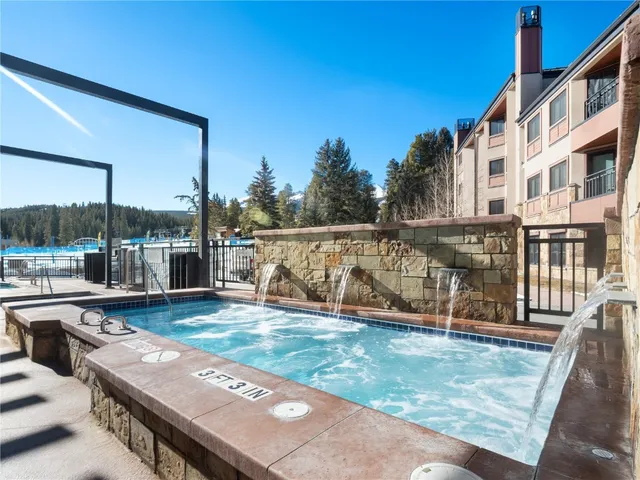 a swimming pool with outdoor seating