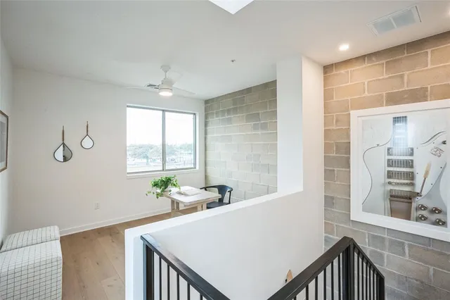 a view of staircase with wooden floor and a window
