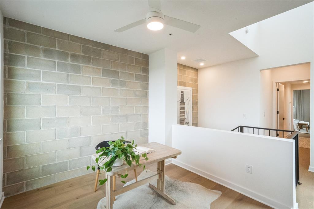 700 Denson Drive, Unit 1102 Austin, TX 78752 - Photo 12 of 30 a view of a room with table and a chair