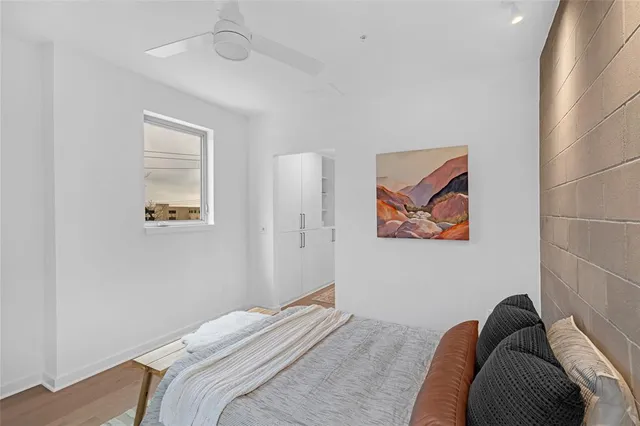 a bedroom with a bed and a chair