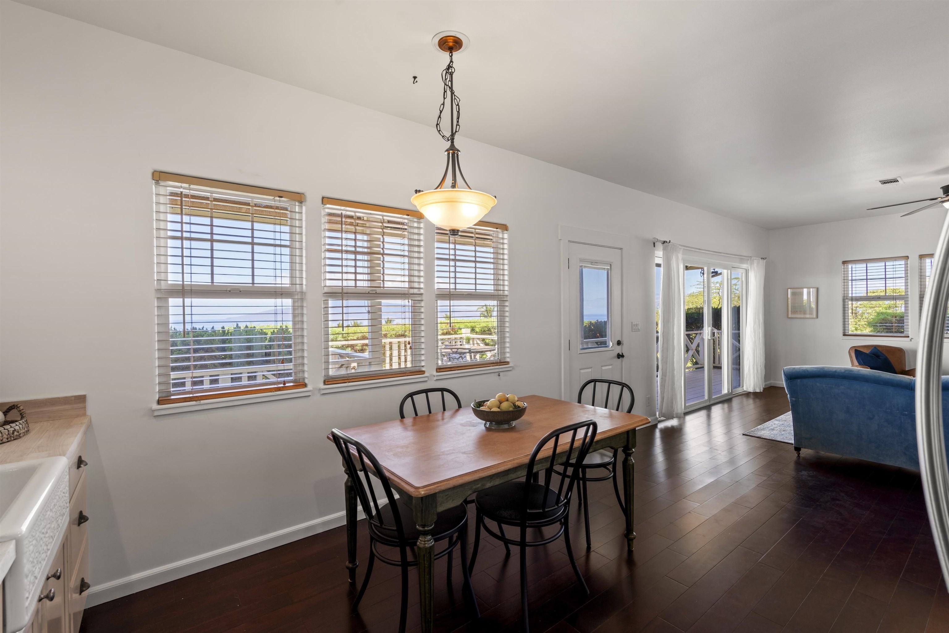 60 East Huapala Place, Unit B Lahaina, HI 96761 - Photo 12 of 50 a view of a dining room with furniture window and wooden floor
