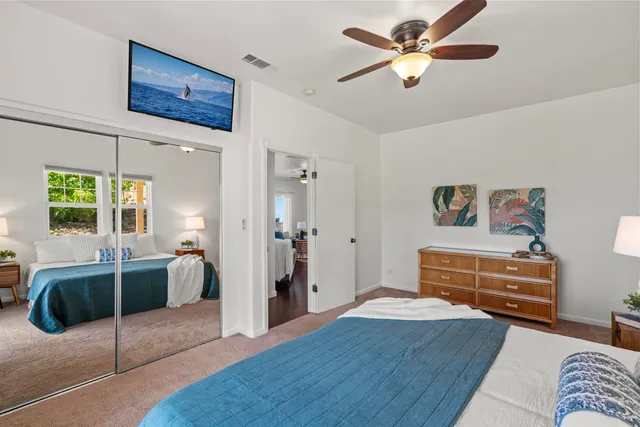 a bedroom with furniture and a chandelier