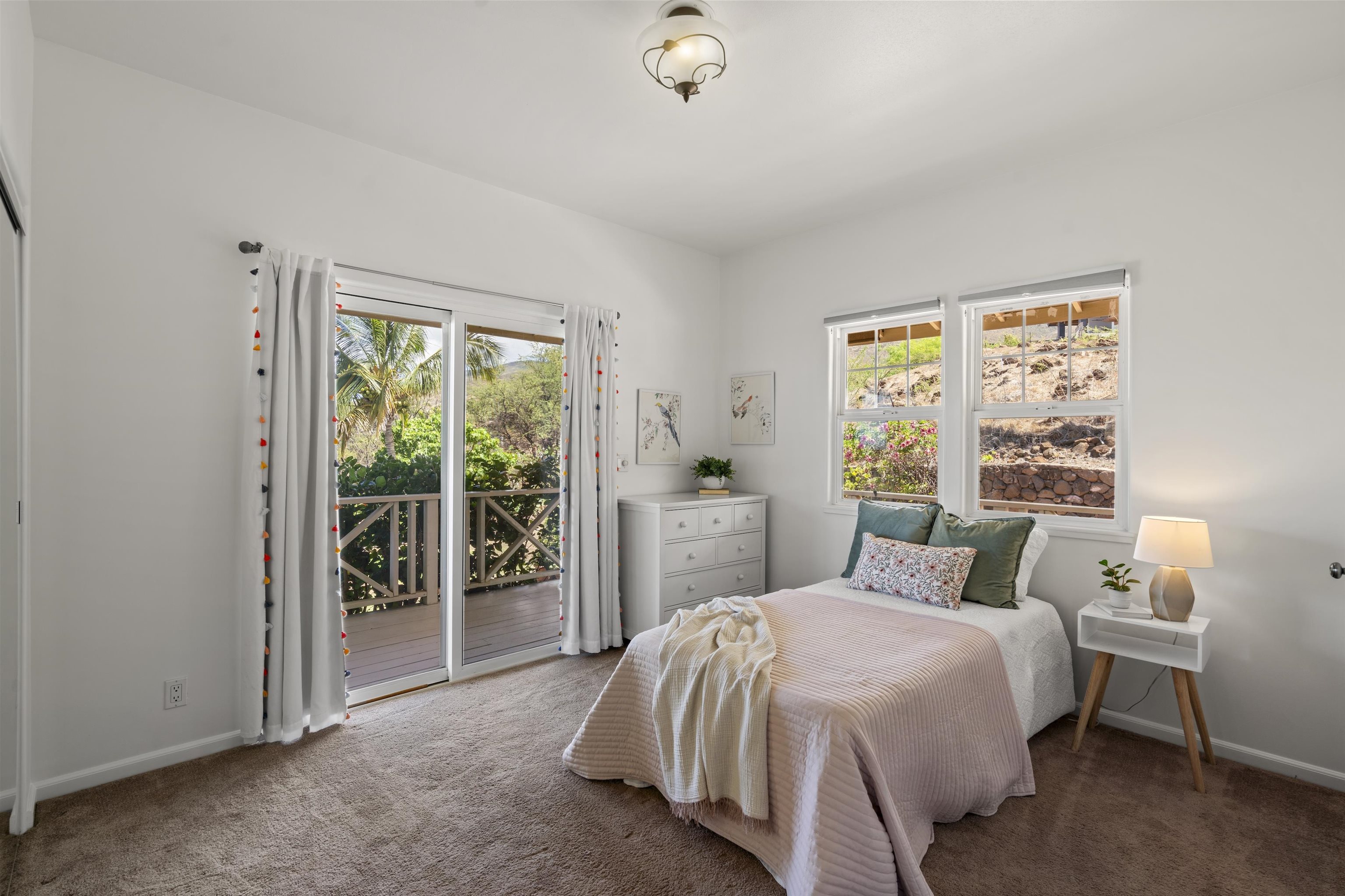 60 East Huapala Place, Unit B Lahaina, HI 96761 - Photo 17 of 50 a bedroom with a bed and a window