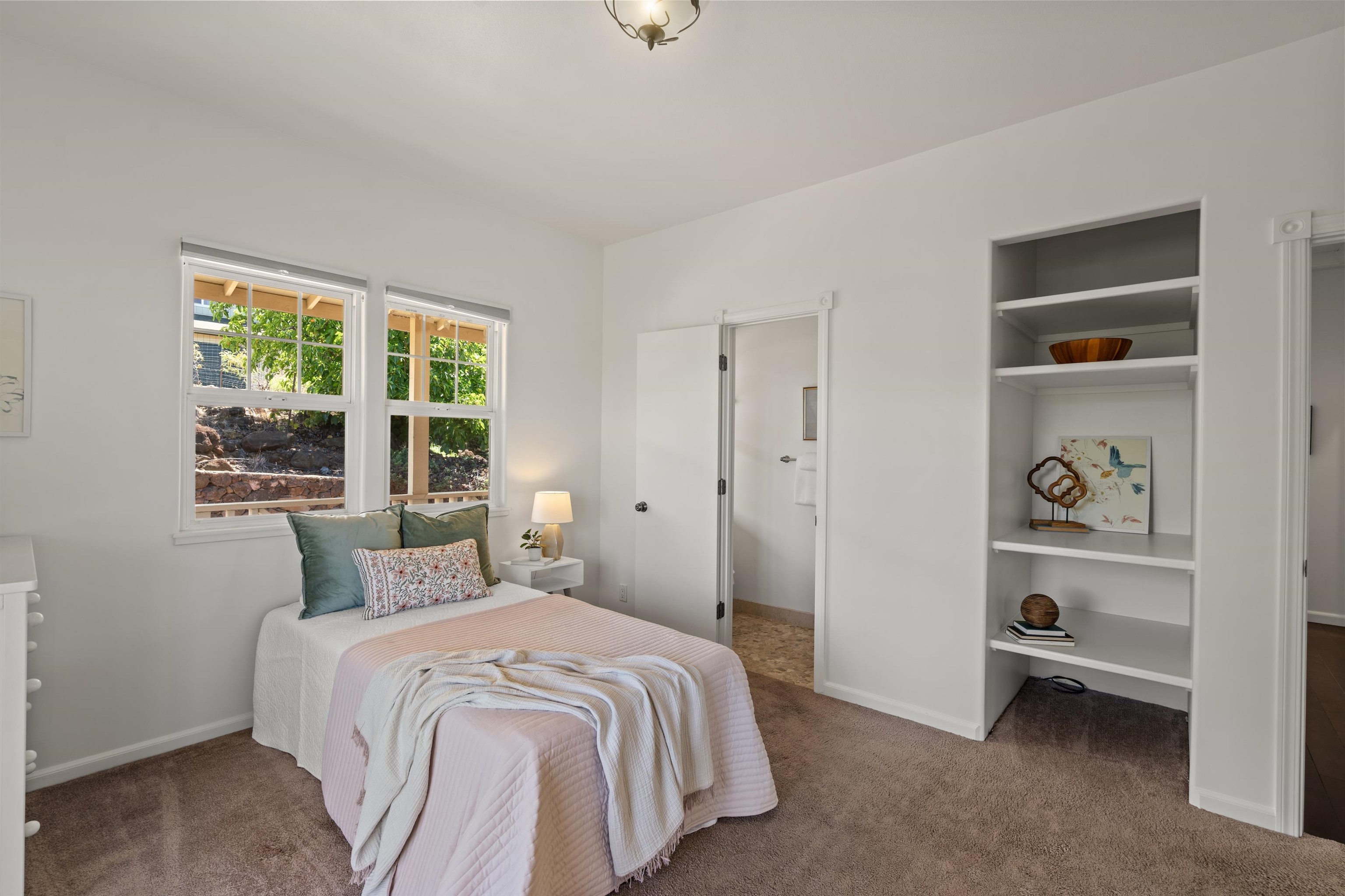 60 East Huapala Place, Unit B Lahaina, HI 96761 - Photo 18 of 50 a bedroom with a bed and a window