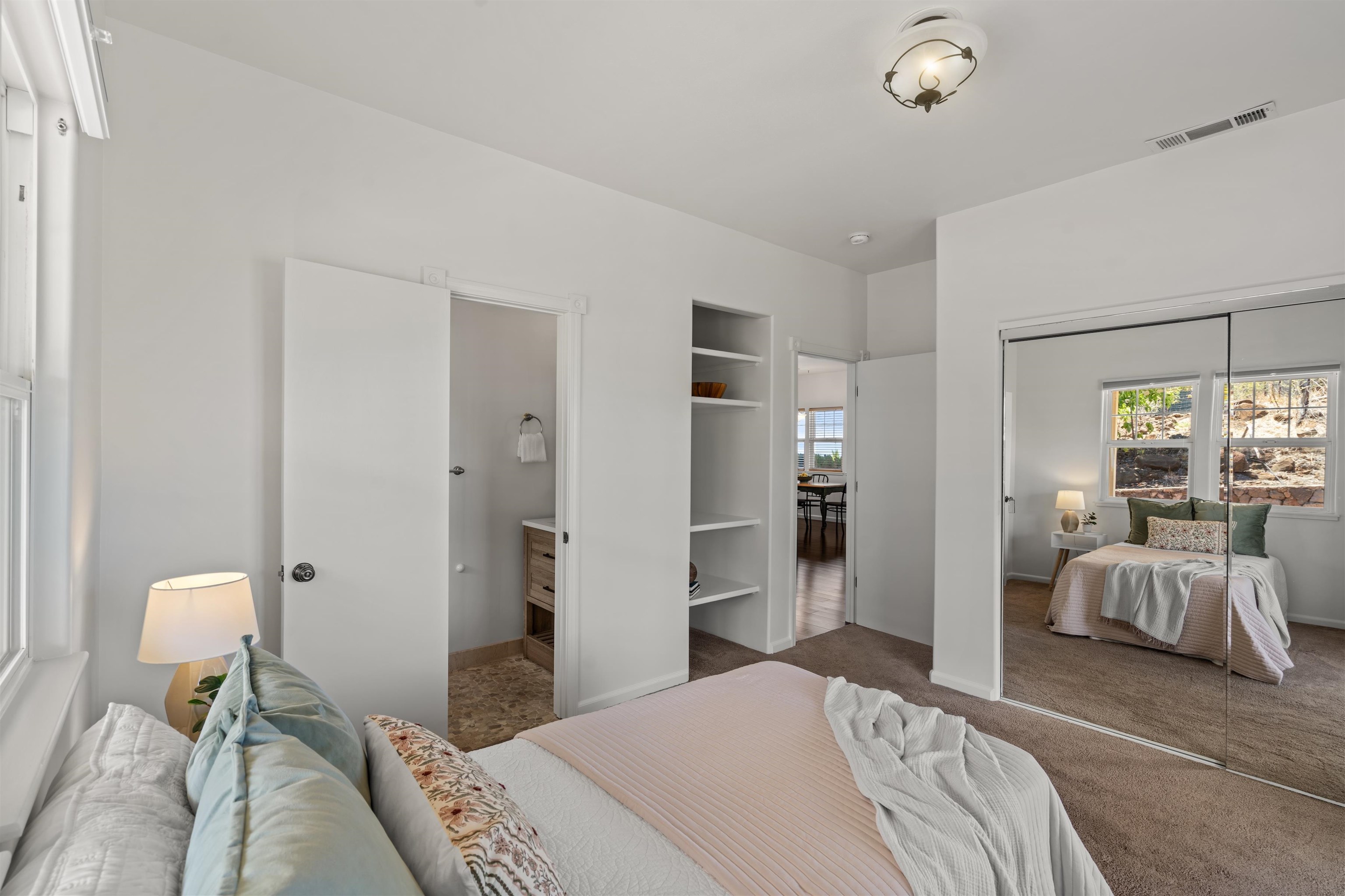 60 East Huapala Place, Unit B Lahaina, HI 96761 - Photo 19 of 50 a bedroom with a bed and chair