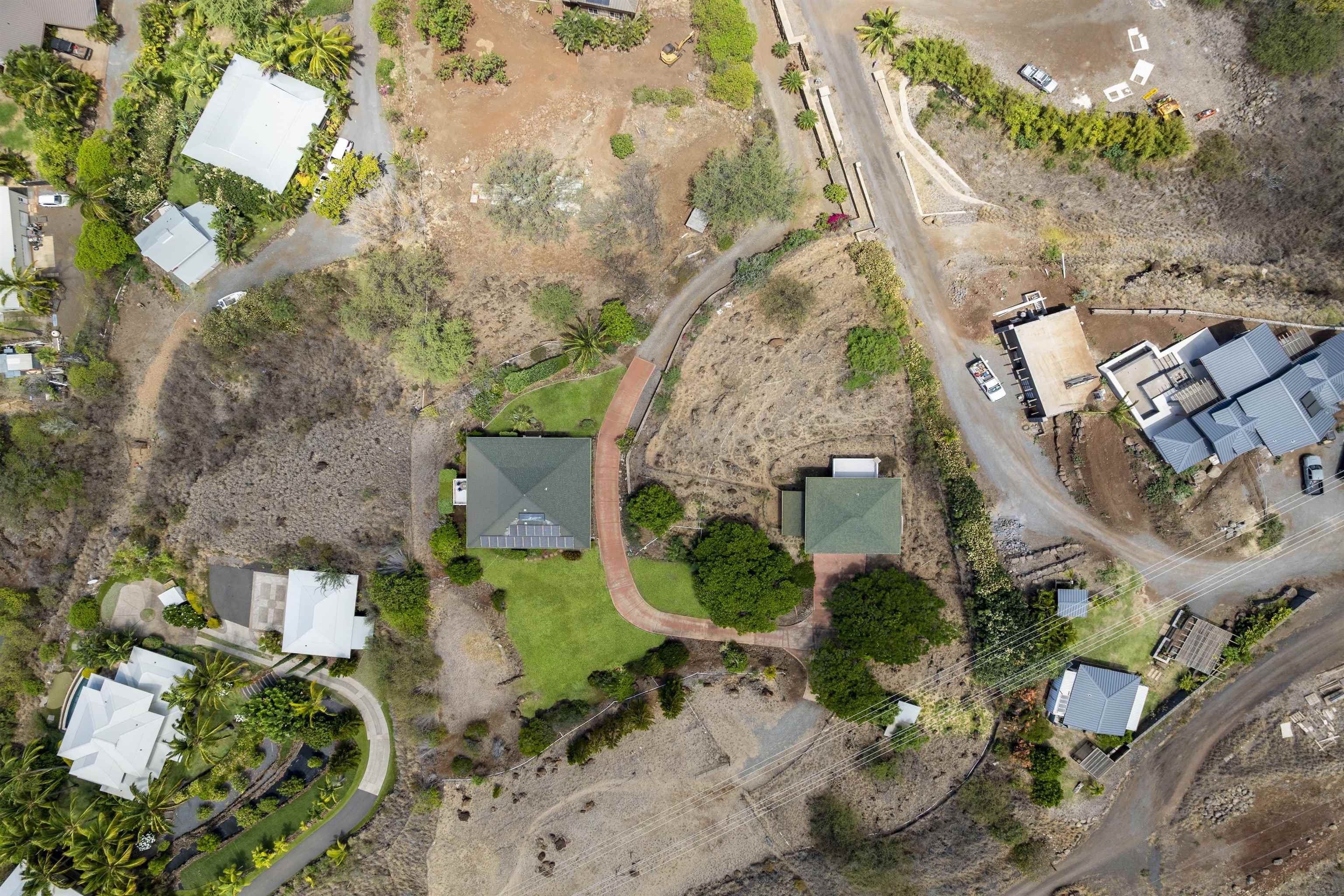 60 East Huapala Place, Unit B Lahaina, HI 96761 - Photo 2 of 50 an aerial view of a house with a yard and a large tree