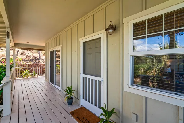 a view of a balcony with wooden floor