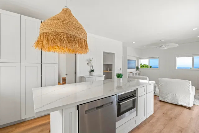 a kitchen with stainless steel appliances granite countertop a sink and cabinets