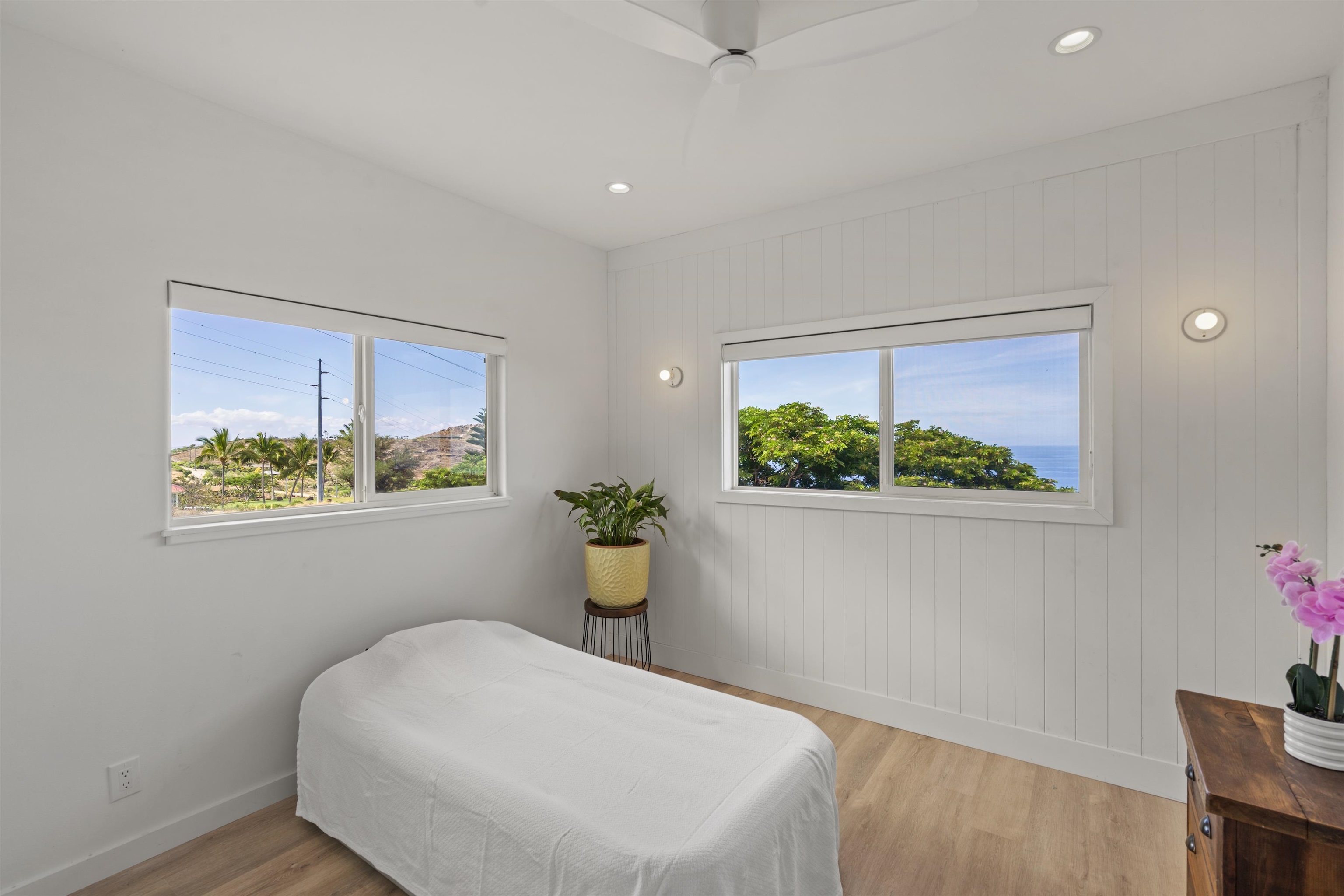 60 East Huapala Place, Unit B Lahaina, HI 96761 - Photo 46 of 50 a white bed sitting in a bedroom next to a window