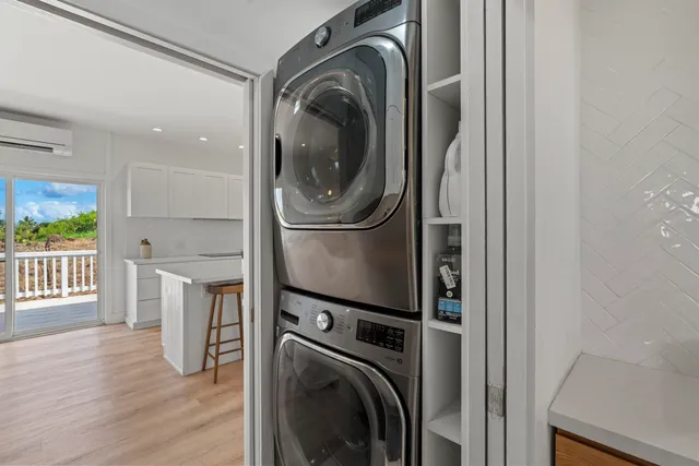 a view of a kitchen with washer and dryer