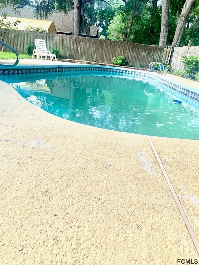 117 Queen Road St. Augustine, FL 32086 - Photo 5 of 16 a view of swimming pool with yard