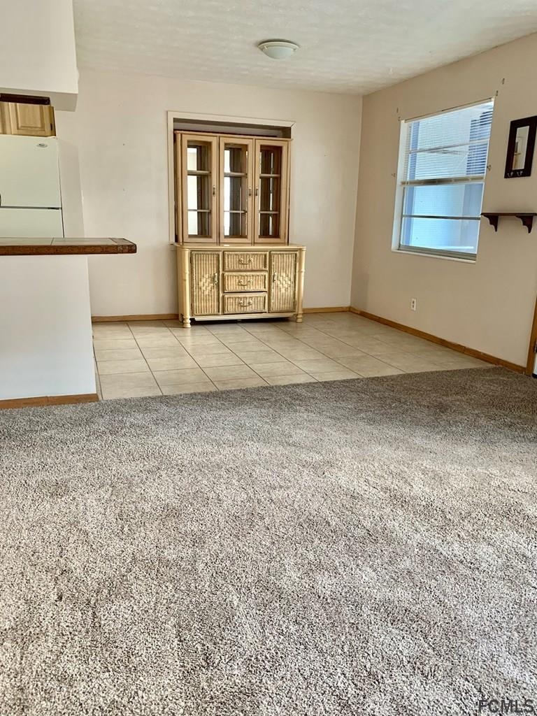 117 Queen Road St. Augustine, FL 32086 - Photo 9 of 16 a view of an empty room with a window