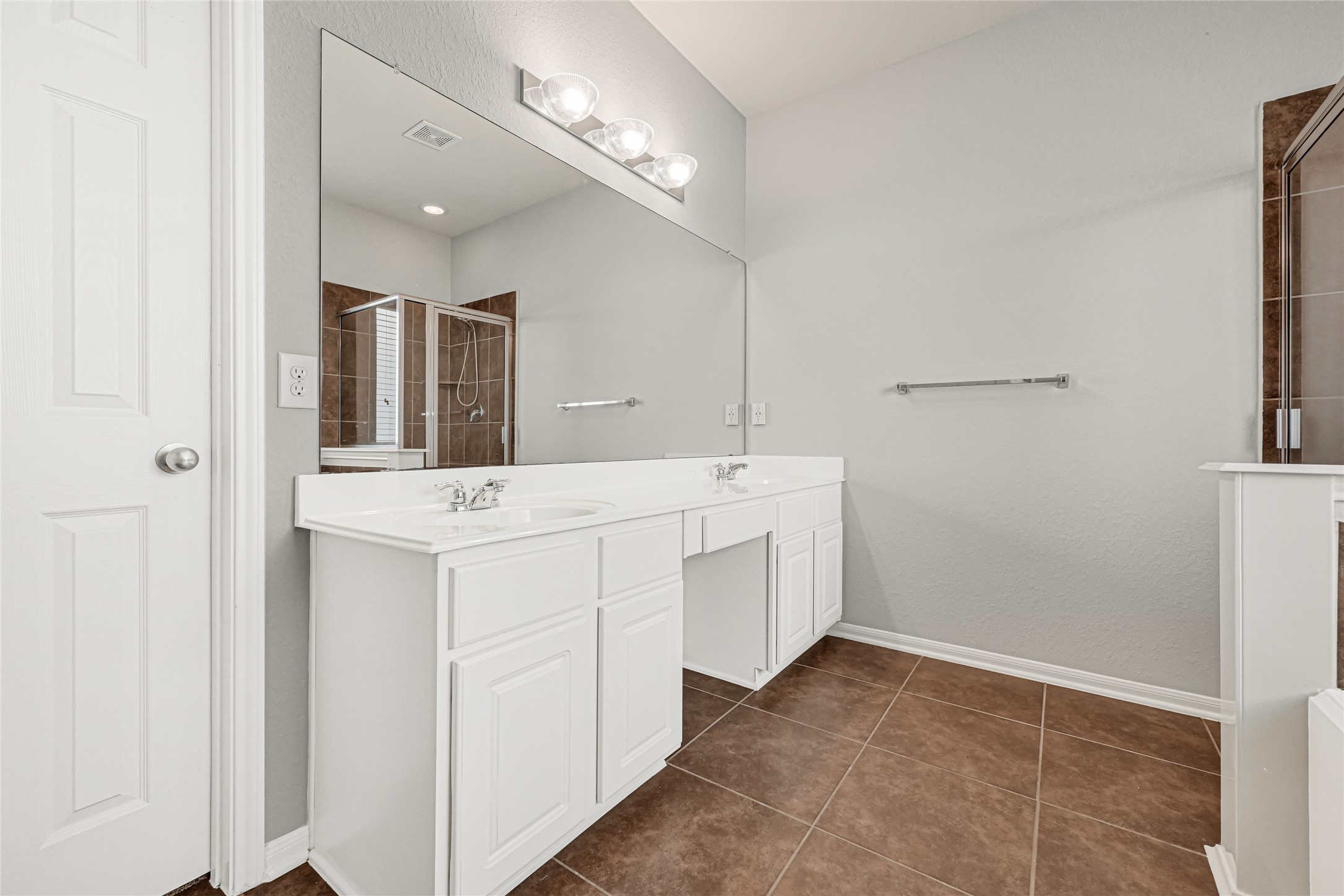 5331 Seabird Street Baytown, TX 77521 - Photo 25 of 38 a bathroom with a double vanity sink and a mirror