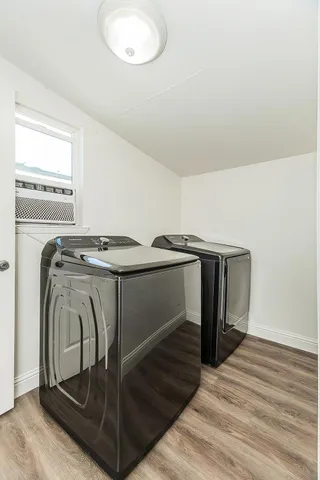 a view of a room with wooden floor