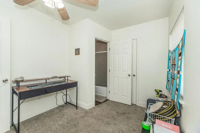 a view of a workspace with furniture