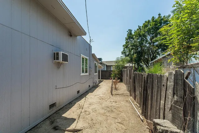 a view of a backyard of the house