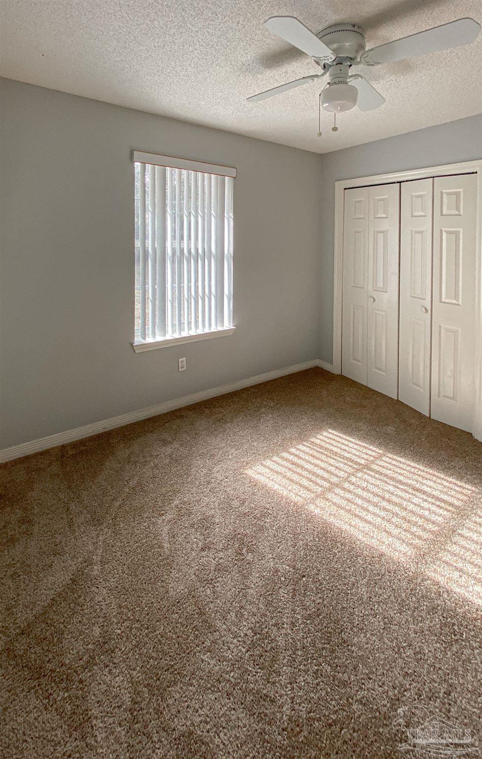12611 Meadson Road Pensacola, FL 32506 - Photo 11 of 22 an empty room with windows