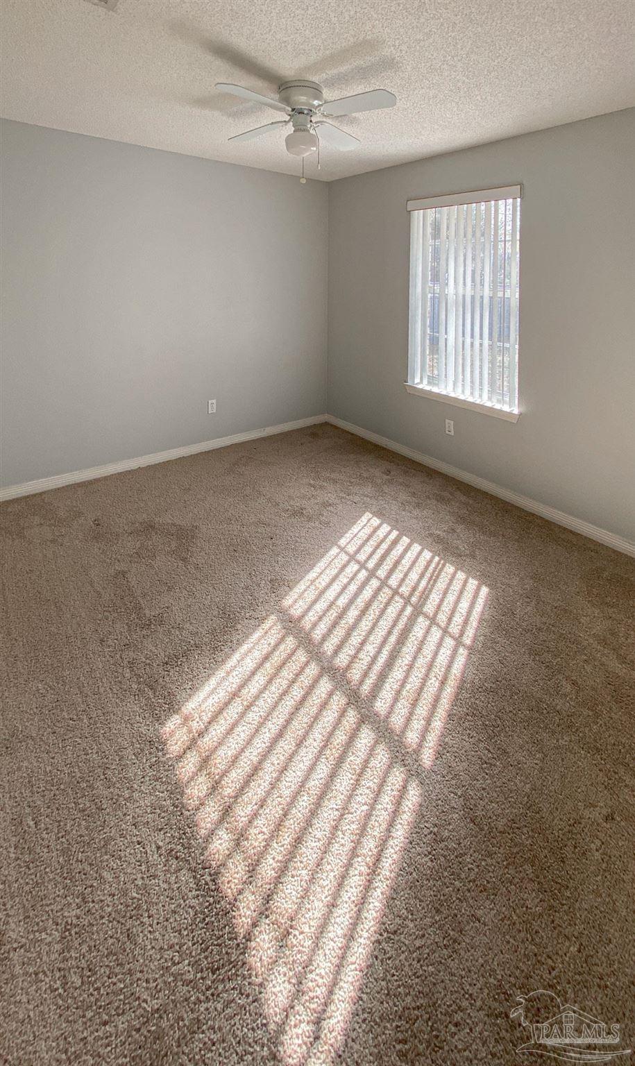 12611 Meadson Road Pensacola, FL 32506 - Photo 12 of 22 an empty room with windows