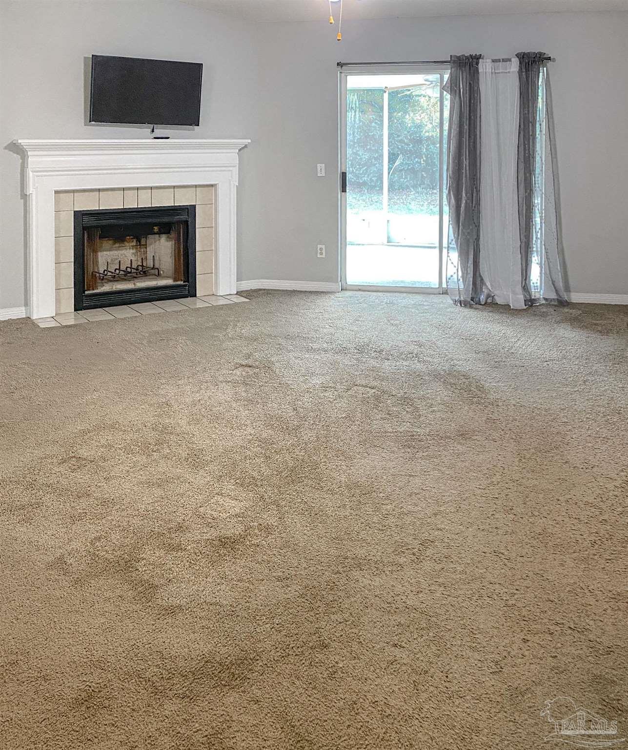 12611 Meadson Road Pensacola, FL 32506 - Photo 3 of 22 a view of empty room with a fireplace