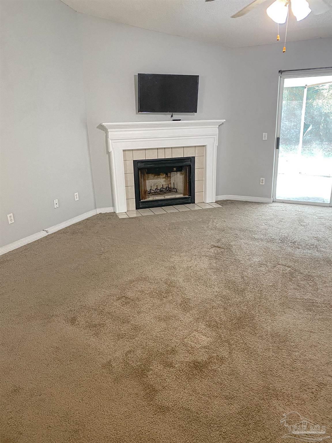 12611 Meadson Road Pensacola, FL 32506 - Photo 4 of 22 a view of empty room with a fireplace
