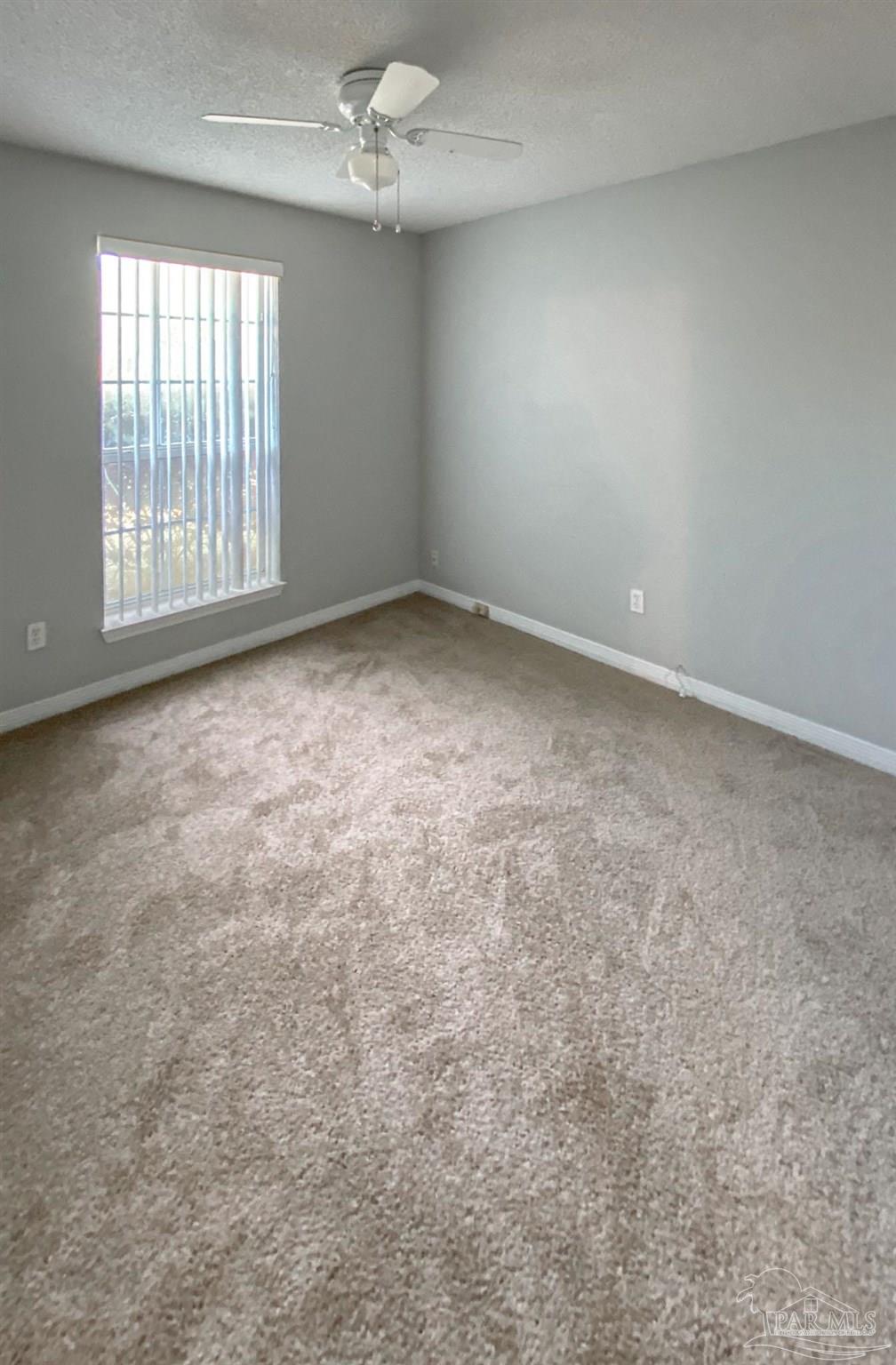 12611 Meadson Road Pensacola, FL 32506 - Photo 8 of 22 an empty room with windows