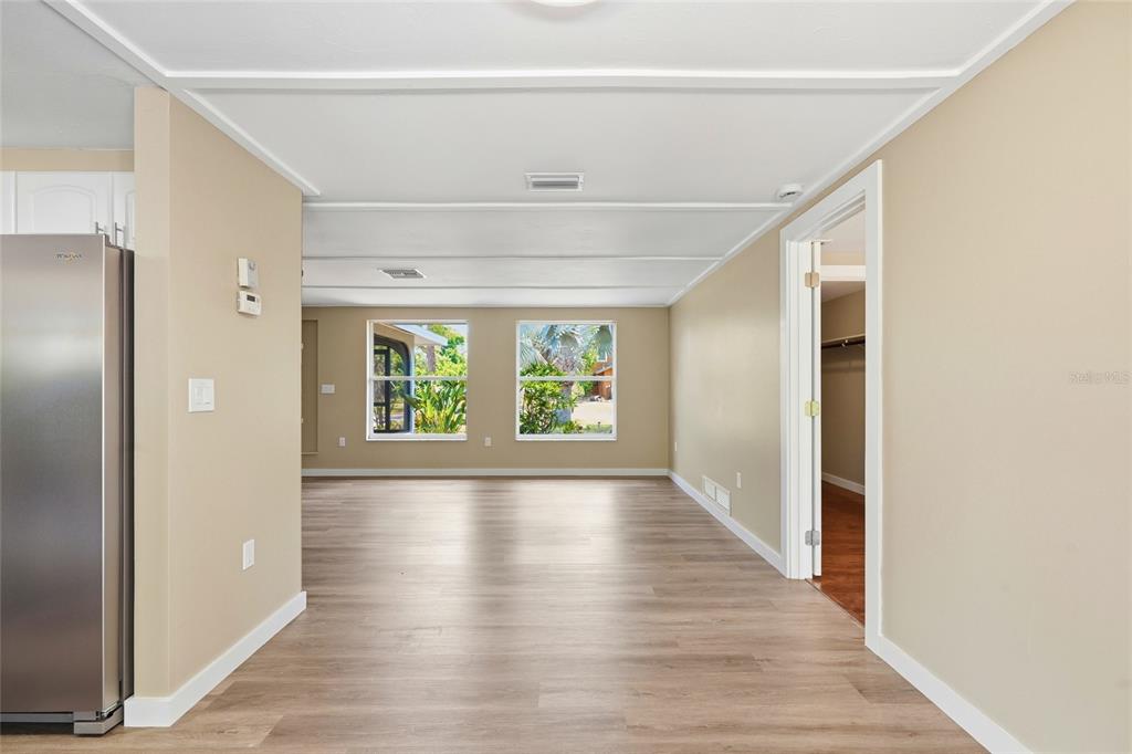 5984 Diana Road Venice, FL 34293 - Photo 10 of 36 a view of an entryway with wooden floor and windows