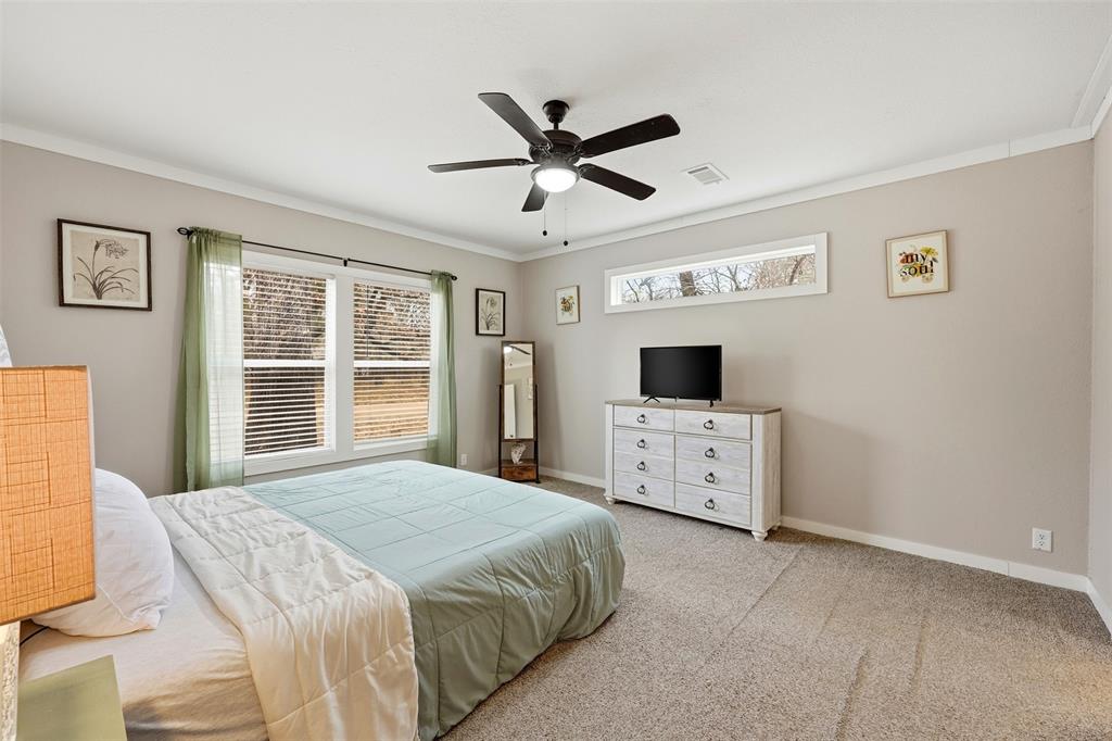 2114 Hickory Street Mabank, TX 75156 - Photo 13 of 31 Primary bedroom with ceiling fan