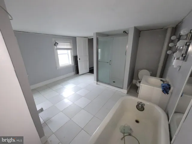 a view of a kitchen with furniture and window