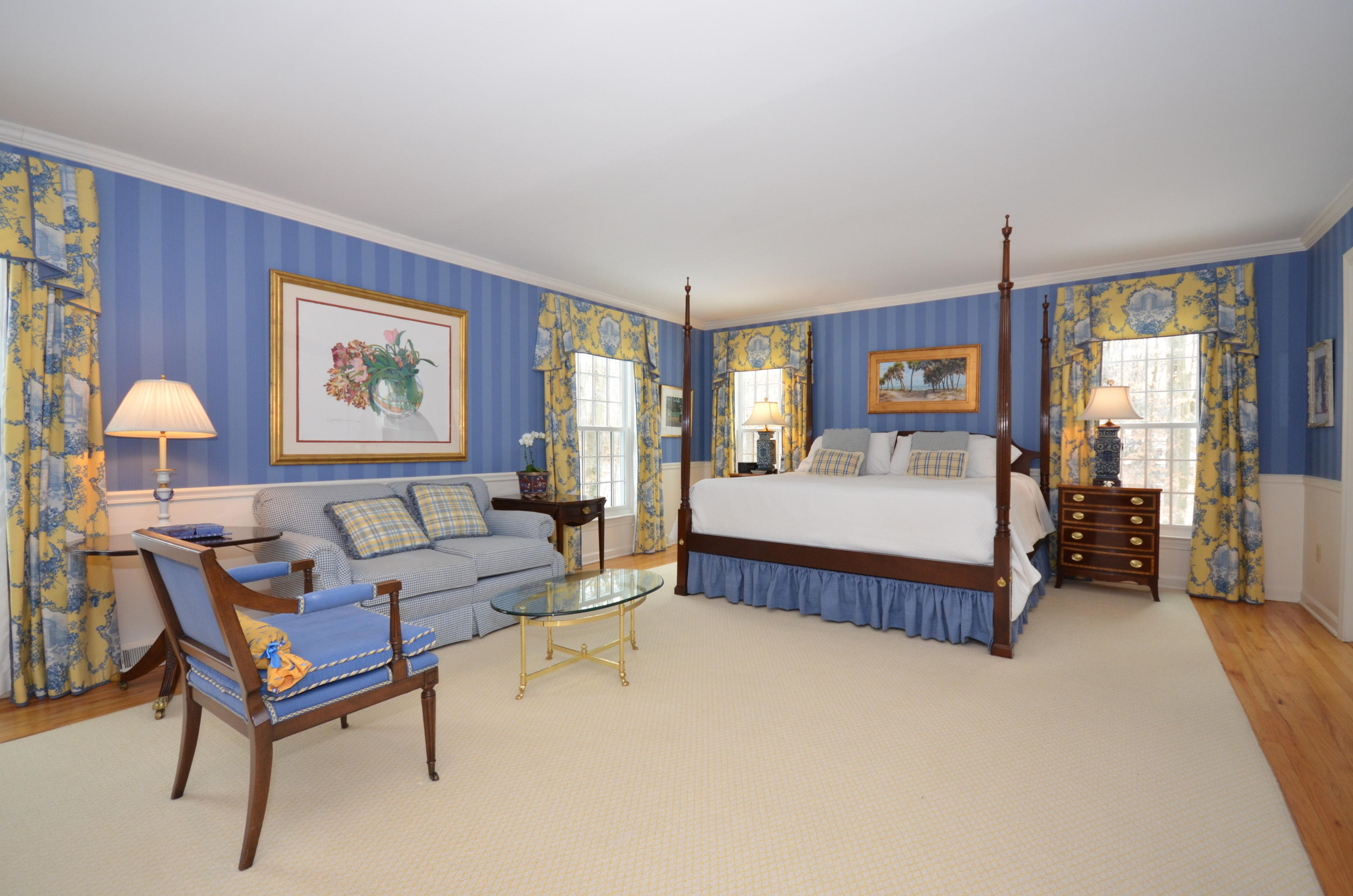 711 Hollow Tree Ridge Road Darien, CT 06820 - Photo 15 of 27 a spacious bedroom with a bed and a window