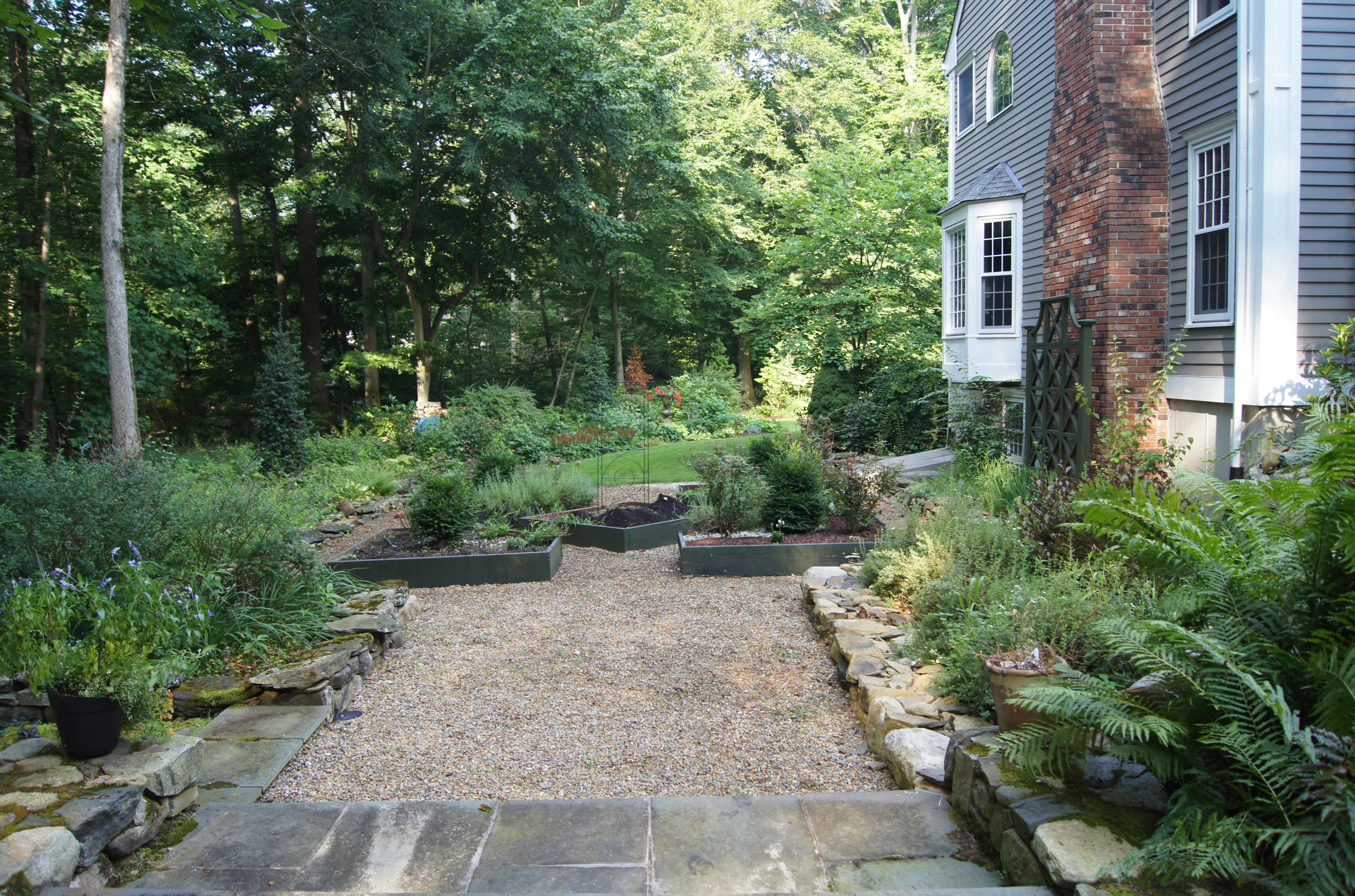 711 Hollow Tree Ridge Road Darien, CT 06820 - Photo 24 of 27 a view of a pathway with plants and large trees
