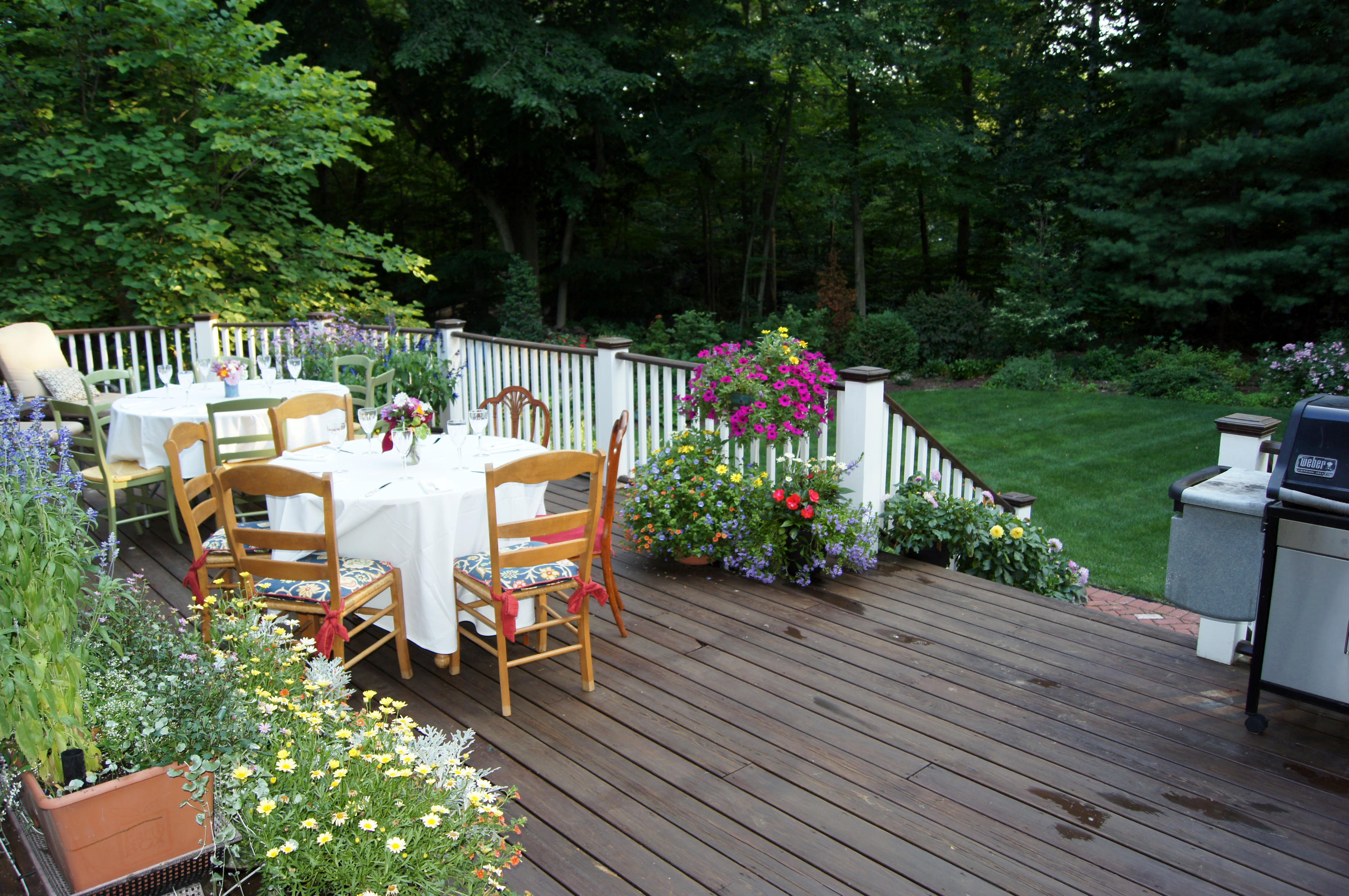 711 Hollow Tree Ridge Road Darien, CT 06820 - Photo 27 of 27 a view of a chairs and table on the wooden deck