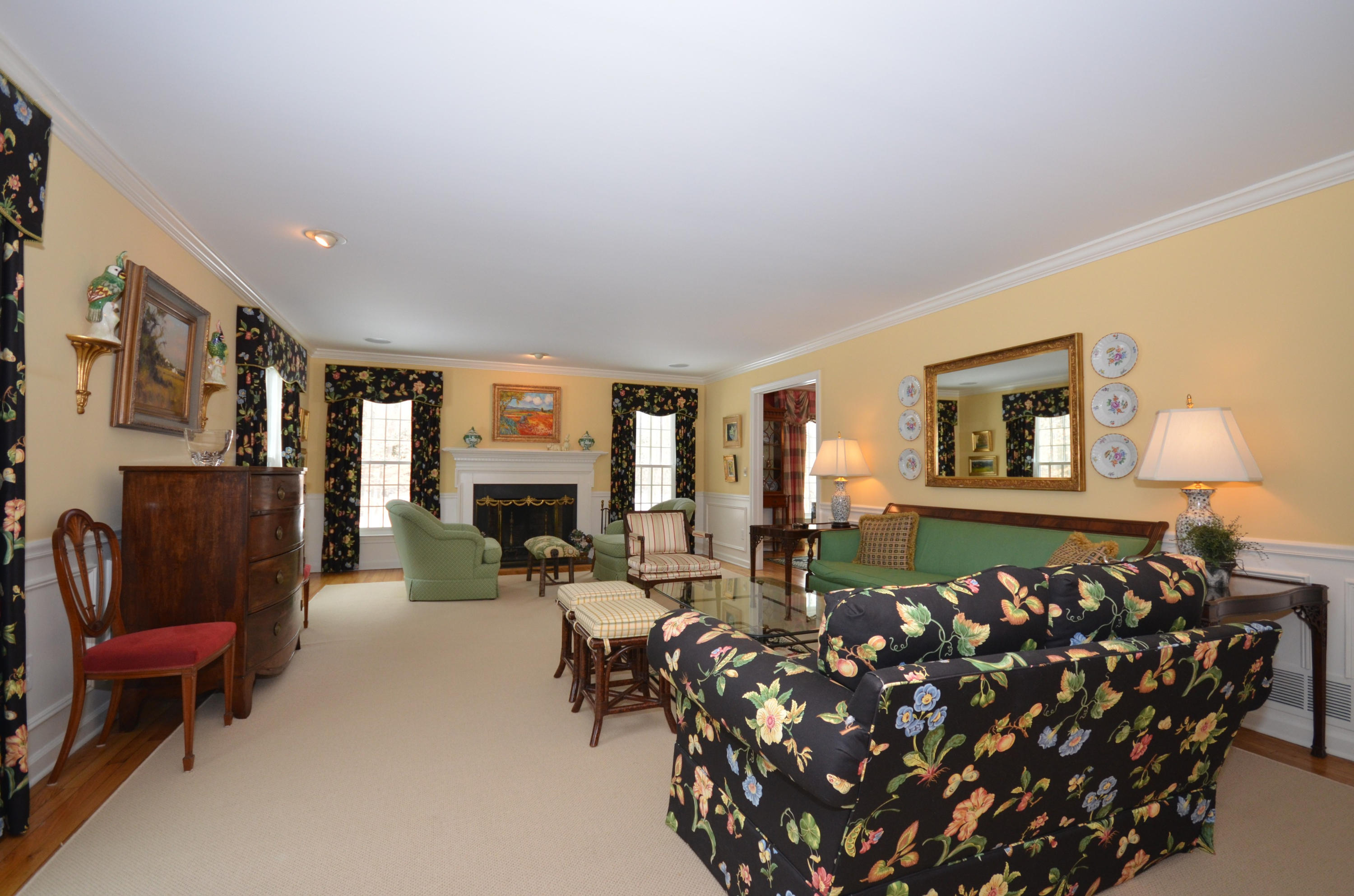711 Hollow Tree Ridge Road Darien, CT 06820 - Photo 3 of 27 a bed room with furniture and a couch