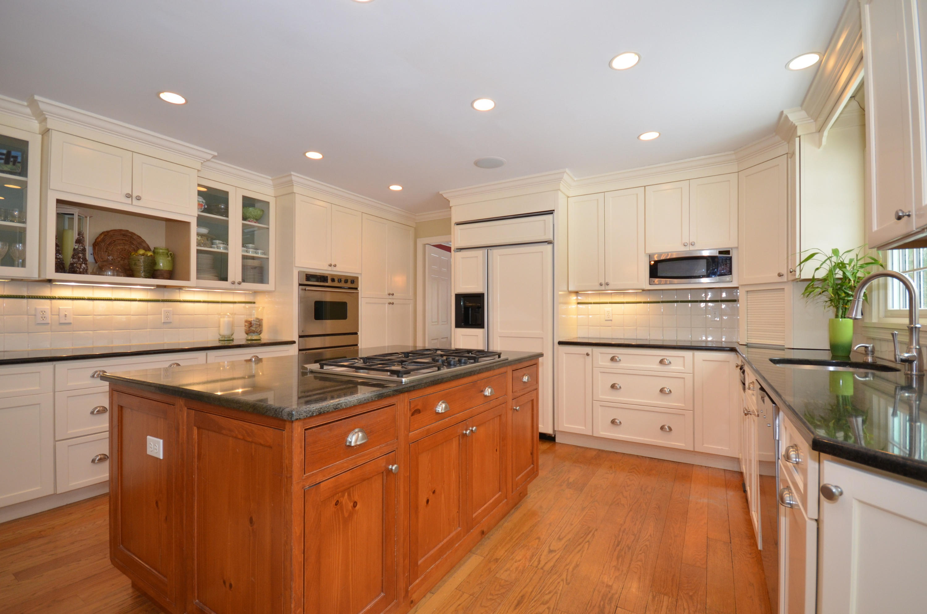 711 Hollow Tree Ridge Road Darien, CT 06820 - Photo 7 of 27 a kitchen with stainless steel appliances granite countertop a stove a sink dishwasher and a refrigerator
