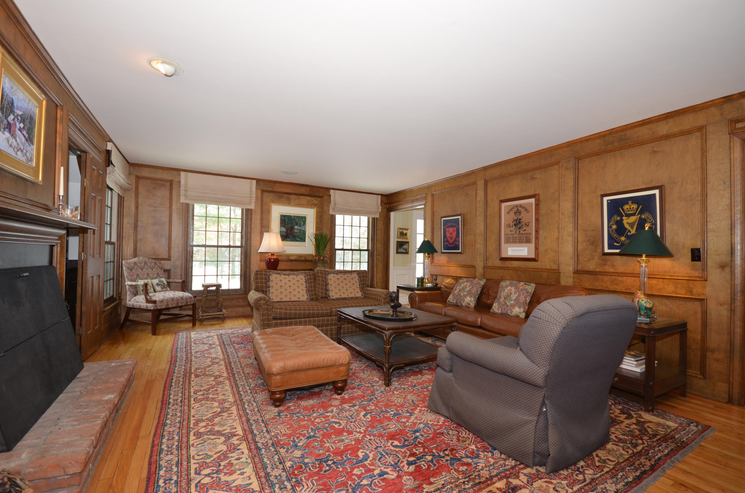 711 Hollow Tree Ridge Road Darien, CT 06820 - Photo 9 of 27 a living room with furniture and a fireplace