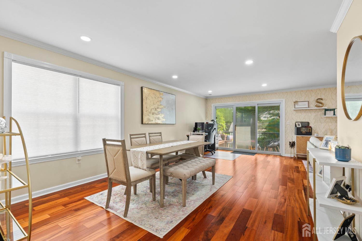 20 Lindsey Circle, Unit 20 Old Bridge, NJ 08857 - Photo 5 of 22 a living room with furniture a large window wooden floor and a rug