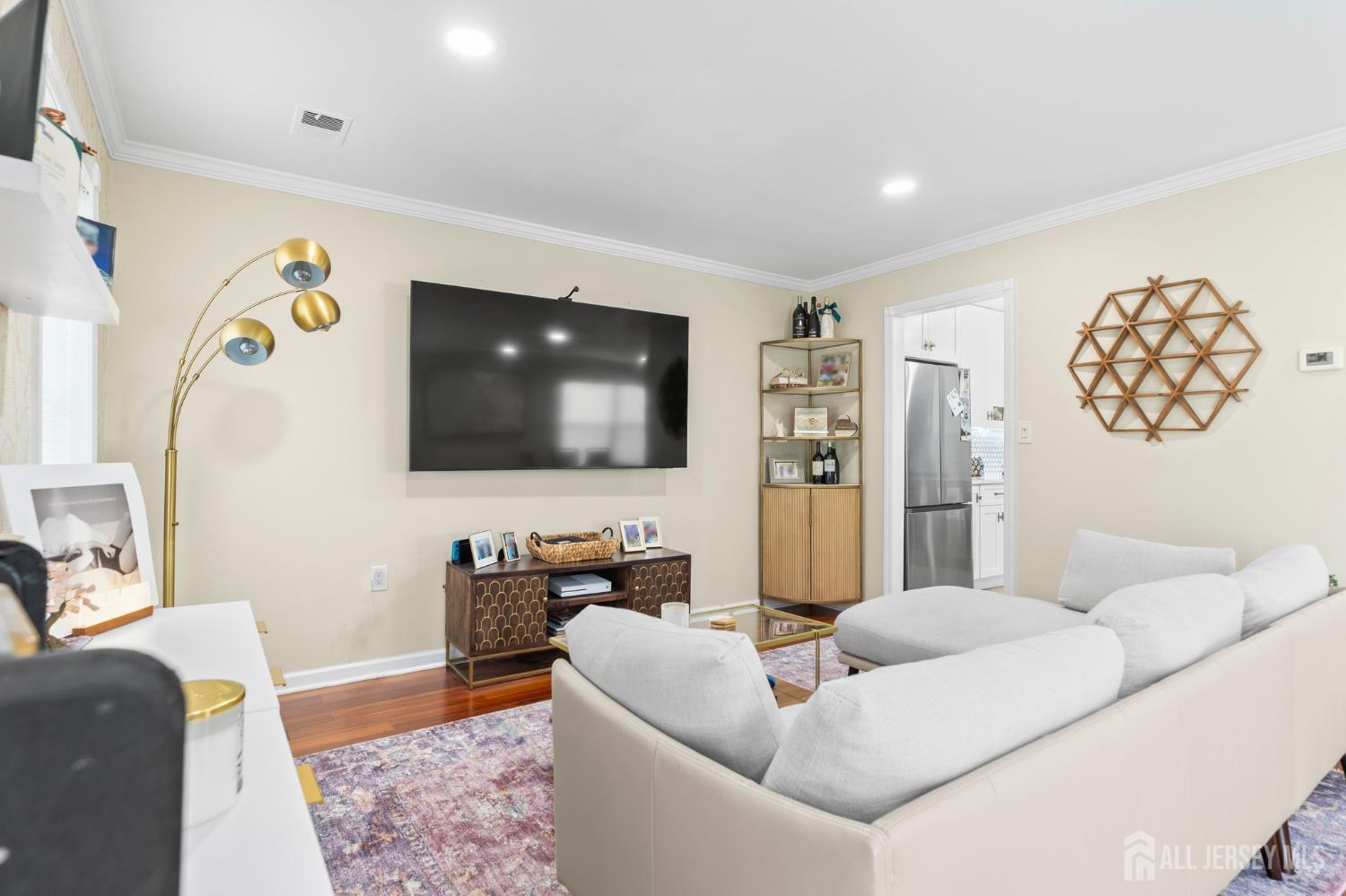 20 Lindsey Circle, Unit 20 Old Bridge, NJ 08857 - Photo 8 of 22 a living room with furniture and a flat screen tv