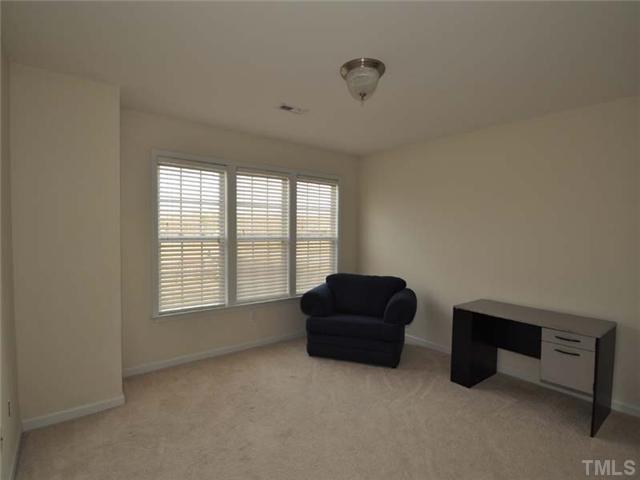 1129 Sandel Lane Raleigh, NC 27603 - Photo 11 of 12 The second floor bonus room is a wonderful multipurpose space for and office or playroom.